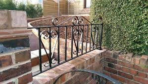 Cedar corbels and custom exterior can lighting set this house apart from others. Beautiful Wrought Iron Garden Gates And Railing Installations In South Yorkshire