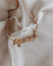 Our diamond jewelry store allows you to send gifts to india or purchase exquisite quality fashion jewellery or engagement rings for men & women for your own collection. Aquarius Script Necklace Gold Zodiac Nameplate Rock N Rose Rock N Rose