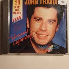 John Travolta : Sandy , pop