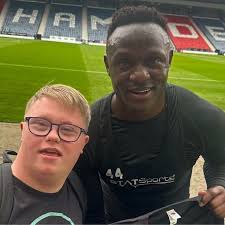 Young Celtic fan with Down syndrome 'buzzing' in emotional reunion with  hero Wanyama