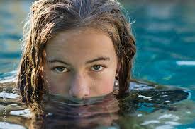 13 year old girl in swimming pool Stock Photo