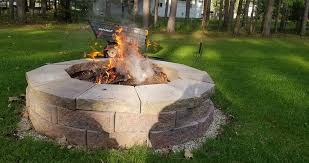 All you need to do is level the ground, add sand and gravel, and then build up the fire pit using landscape wall stones. Retaining Wall Block Fire Pit Project By Mike At Menards