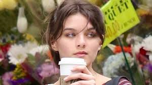 Suri Cruise is spitting image of Dawson's Creek star mom Katie Holmes as  she picks up flowers in NYC