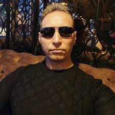 An officer pulls over a man and a woman for driving 20 miles per hour over  the posted speed limit. The officer approaches the car, sees an  affluent-looking late-50s man behind the