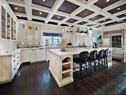 Navy blue and shades of white dominate the space, capped off by a classic white coffered ceiling and a geometric light fixture. Interior Design Ideas Home Bunch Interior Design Ideas