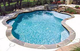 Tanning Ledge Pool And Sun Shelf Pictures Blue Haven Tanning Ledge Pool Kidney Shaped Pool Blue Haven Pools