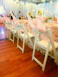 Reserv S White Folding Chairs At A Fairy Garden Themed Kiddie Party By Planners Plus At The Manila Polo Kids Folding Chair Party Table Settings Polka Dot Party