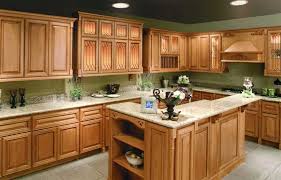 A note about color… when choosing a wall paint color it is important to remember that honey oak cabinets bring more of a color to a kitchen than other wood cabinets. Light Green Kitchen Walls With Oak Cabinets Google Search Honey Oak Cabinets Maple Kitchen Cabinets Kitchen Remodel