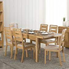 9pc dining set includes an oval dining table with butterfly leaf and eight parson chairs with dark coffee fabric, oak finish. Curve Oak Dining Set Extending Table Jb Focus Furnishing