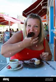 Fat woman eating hi-res stock photography and images - Alamy