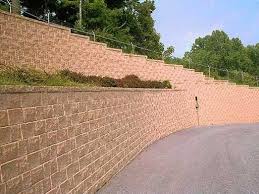 Concrete block retaining wall construction consists of number of phases including excavation, foundation soil preparation, retaining wall base construction, concrete block unit placement, grouting and drainage system installation. Segmental Retaining Walls The Concrete Network The Concrete Network