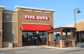 The layout is clean and modern and it's clear where to go to buy, sell and earn rewards. Five Guys Survey