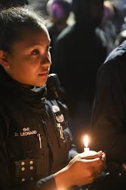 Police and community members gather for Detroit officer Rasheen McClain