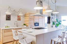 Below we see both color and metallic shine in an airy kitchen that celebrates contemporary design. Scandinavian Design Kitchen Island