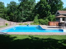 This is a perfectly curvy and absolutely gorgeous cutout. Another L Shaped Pool Design With Pavers Backyard Pool Swimming Pool Designs Pool Floaties