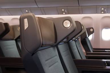 Cathay Pacific's Premium Economy seat featuring integrated headrest privacy wings.