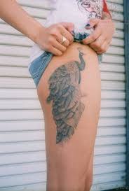 Peacock tattoos are extremely graceful and beautiful. 49 Superb Peacock Tattoo On Thigh