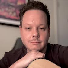 I read Chet had a love for playing the banjo. Can't locate any videos of  him going all out and playing one, however, I imagine he sounded really  good since his rendition