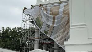 Scaffolding, drapes go up around White House North Portico for repairs