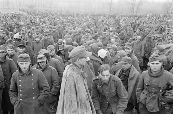 Pictures of German Prisoners in a holding area in the US 2nd Armored  Division area of advance into Germany - April 1945 Some of these pictures  were possibly taken in / near