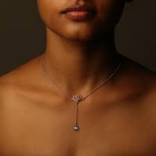 Similar to a bolo tie, a lariat necklace consists of a looped cord and a decorative clasp. Enlight Lariat Necklace London Blue Topaz Eina Ahluwalia