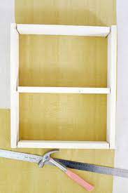 This is part one of a three part series on how to build a recessed wall/medicine cabinet. Hidden Medicine Cabinet Diy A Beautiful Mess