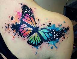 Love The Black With Rainbow Colours Not So Much The Water Colour Around The Edge Butterfly Tattoo Designs Watercolor Butterfly Tattoo Tattoos
