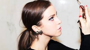 Swap the classic red lip for a bold navy eye this New Year's Eve