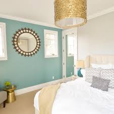 These dark walls are further encouraged by the use of blue textiles and decor. Photos Hgtv