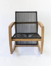 The chair's seat and back are made of wooden blocks that are strung through the frame with 5/16 nylon rope. Rope Teak Rocking Chair Van Eijsden