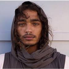 Dark Man Nose Pierce Big Thick Eyebrows Curly Long Hair Light Brown Eyes And Beard Portrait Interesting Faces Face