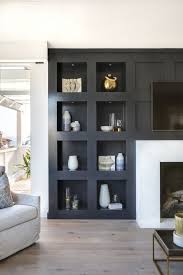 A modern spin on cabin decorating. Jet Black Built In Bookcase Jet Black Built In Bookcase Bookcase Cabinetry Paint Grade Living Room Decor Traditional Living Room Remodel Living Room Built Ins