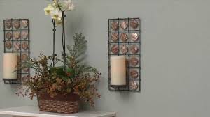 This modern black wall sconce candle holder is one of the most incredible wall sconces you'll find. Equinox Flameless Candle Sconce With Shells Pacific Accents