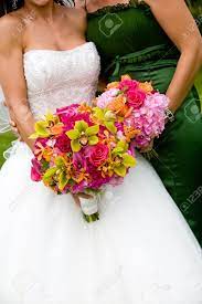Burgundy red is an exquisite option to boldly pair with navy blue as seen here. Two Wedding Bridal Bouquets In Red Pink Green And Orange Stock Photo Picture And Royalty Free Image Image 13162466