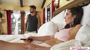 Shemale stepmom is on the bed with her stepson watching shemale porn. After  that, they start stroking their cocks and her stepmom throat his big cock  passionately. In return, he barebacks her