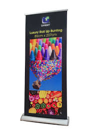 Bunting has size constraint compare to banner, lesser information in one than banner and need more bunting quantity to create eye catching visual effect compare to banner. Roll Up Bunting