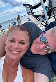 Hi, could someone please naturally touch up my grey roots and remove the  woman standing with her unhappy child in the background? I love this  picture and tried to edit it myself