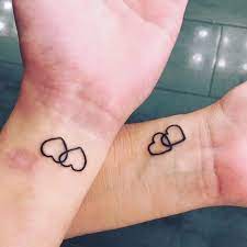 Unique couple tattoo design ideas you'll love. The Hearts Couple Tattoo Design Meaningful Couple Tattoos Meaningful Tattoos Crayon