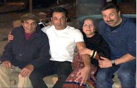 Dressed in jacket, his trademark outfits from the 80s, and a pair of pants, the actor was seen standing with his hands resting on a railing. Dharmendra Birthday Special Proof That Bollywood S He Man Is A Family Man