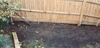 How to stop foxes digging up my garden? Fox Badger Fencing Protection South London Fencing