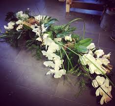 (we are the preferred florist for the tabor funeral home in. White Orchid Coffin Top Butterfly Flowers