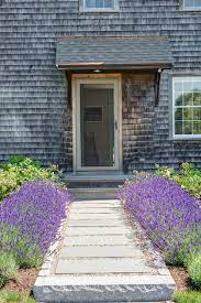 Consider this beautiful combination of californian poppies and lavender flanking across the walkway. 9 Ways To Use Lavender In Your Garden Design