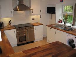 We also have a wide range of splash panels and flooring which can be used in kitchens, bathroom and any room in the house. Cream Kitchen Cupboards With White Tiles Novocom Top