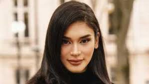 Mark Bumgarner, stands by Pia Wurtzbach as first Filipina to walk L'Oreal  runway