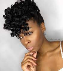 You can tape or clip a small weft of extra length around any ponytail and scrunch it up into a figure 8 to create similar origami style buns, like the ones seen here. 50 Updo Hairstyles For Black Women Ranging From Elegant To Eccentric