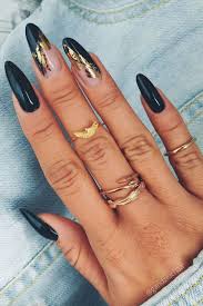 Long Black Almond Shaped Nails Elegant Black Nails Almond Shaped Long With Adorned With Gold Foil Winternails Winternailcolors Winternailart Almo Long Almond Nails Foil Nails Gold Nails