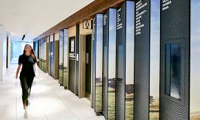 Animating A Main Access Corridor A Lenticular Wall Installation Displays Rural Imagery Alongside Digital Screens That Te Wayfinding Signage Signage Wayfinding