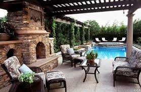 Expansive classic back garden in salt lake city with a fireplace and concrete paving. Garden Landscaping Ideas And Creative Backyard Designs