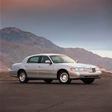 Image result for Medium Gold 1998 Town Car