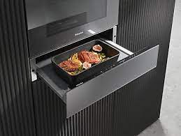 These stainless steel oven warming drawers are an easy and stylish way to keep dishes warm. Miele Crockery And Food Warming Drawer
